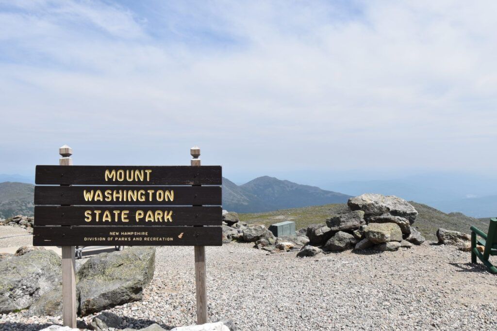 sign on top of a mountain