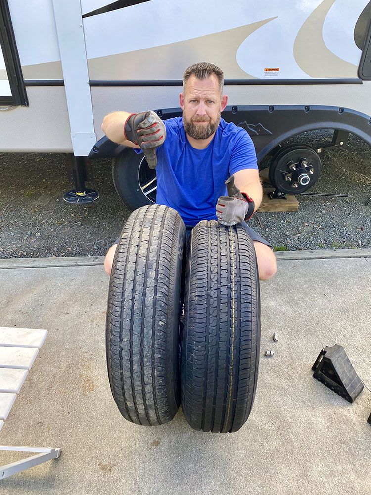 man in front of bad and good tire