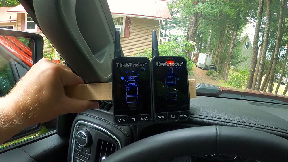 two tire pressure monitors side by side